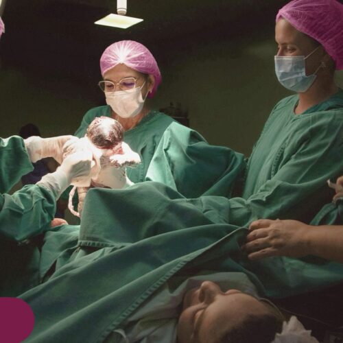 obstetrics surgeons delivering baby
